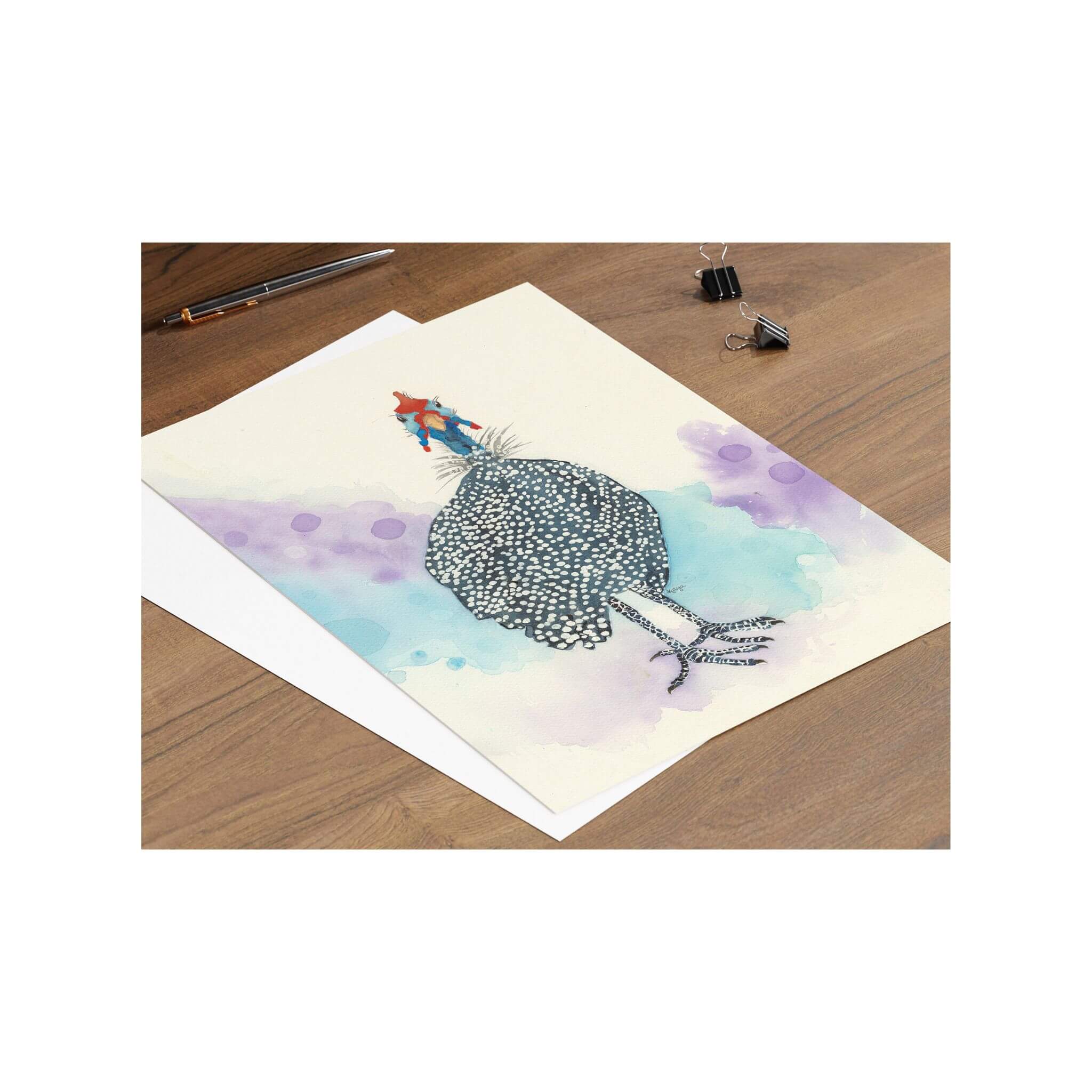 Say it with a smile! Feathered Fun is a whimsical blue guineafowl with white spots, red accents, and a colorful, happy backdrop—perfect for sending a little joy to someone special.