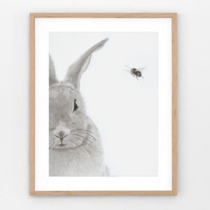 "Honey Bunny" is a charcoal drawing of a fluffy rabbit with a bee hovering nearby, titled "Honey Bunny" — a heartwarming blend of nature and nostalgia.