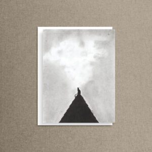 Black cat notecard featuring a charcoal illustration of a cat silhouette on a steep rooftop peak against a cloudy sky, styled on natural linen with a white envelope.