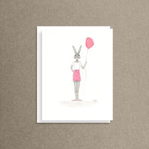 Balloon bunny note card featuring a bunny in pink polka dot shorts holding a pink balloon