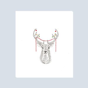 Whimsical Christmas card featuring a deer with colorful baubles and garland on its antlers, festive woodland design.