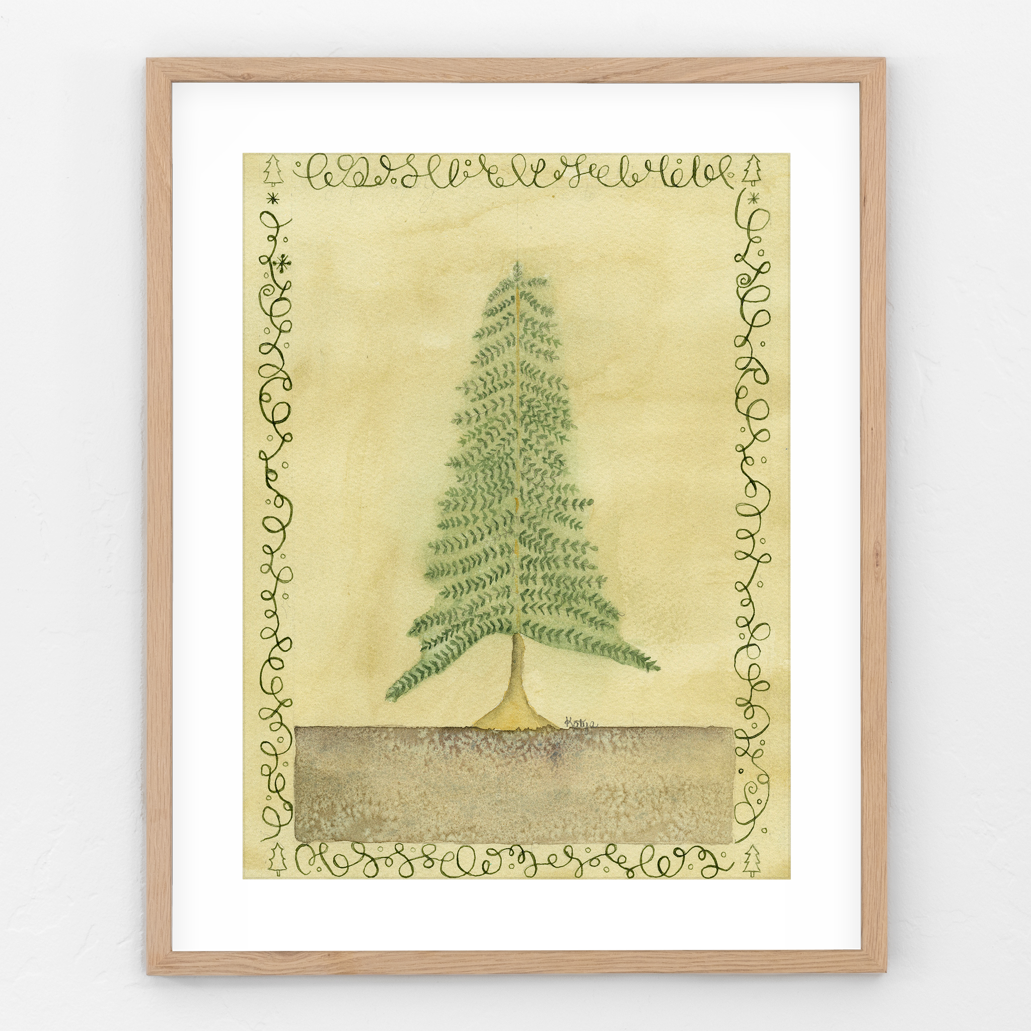 Framed original pine tree watercolor and calligraphy painting hanging on a white wall