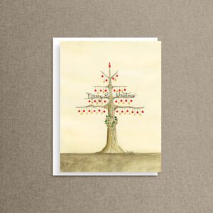 Watercolor Christmas tree card with red and gold ornaments, a holly wreath, and Merry Christmas script, on a white envelope.