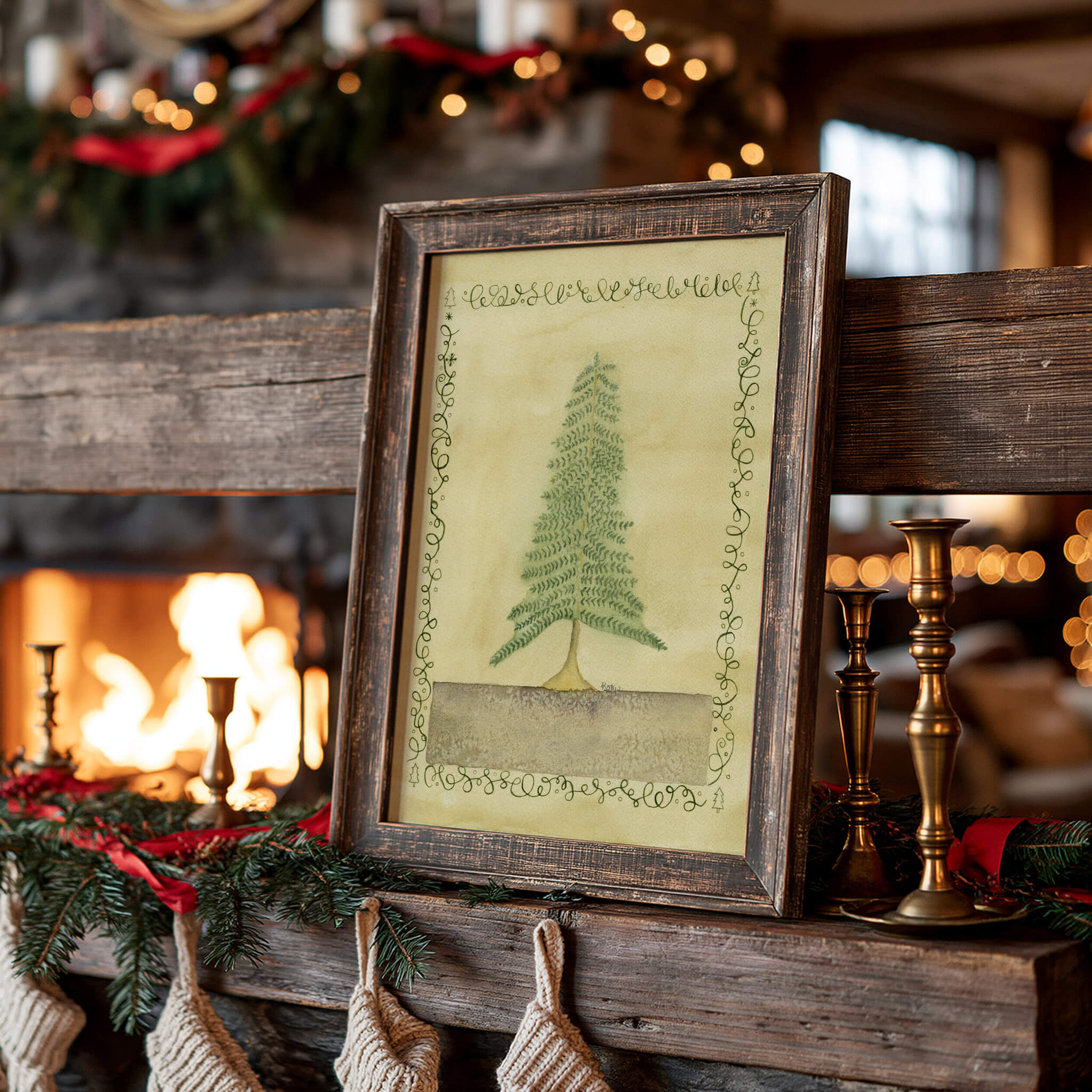 Christmas painting of a watercolor pine tree with a calligraphy border in a rustic wood frame, leaning on a timber fireplace mantel beside brass candlesticks and pine garland