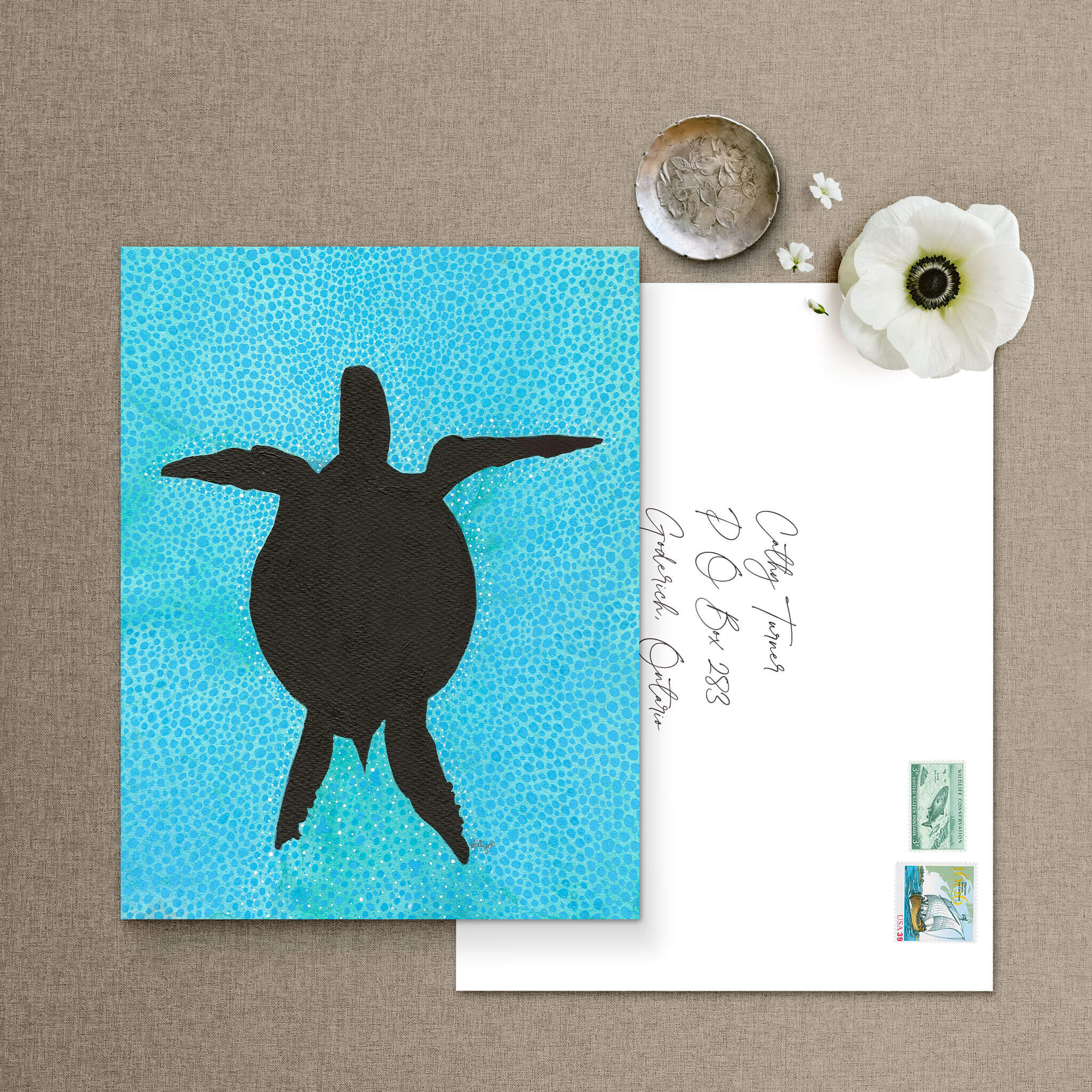 Turtle silhouette note card with addressed envelope and postage stamps