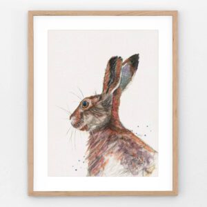Radish the Rabbit whimsical bunny art print in neutral wooden frame featuring colorful textured rabbit illustration for nursery and cozy home wall decor.