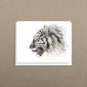 Black and white tiger card with a windswept mane, propped against a neutral linen background.