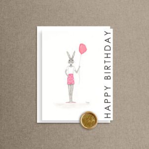 Happy Birthday balloon bunny card featuring a bunny holding a pink balloon, with a gold "With Love" wax seal on the envelope